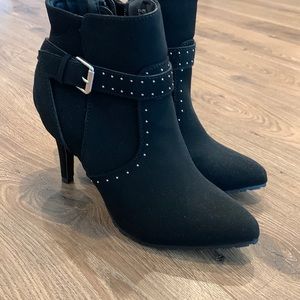 Black high heeled boots with buckle